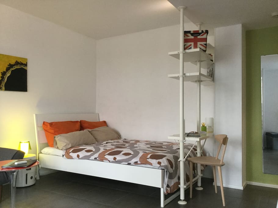 Double bed and bookshelf/laptop stand