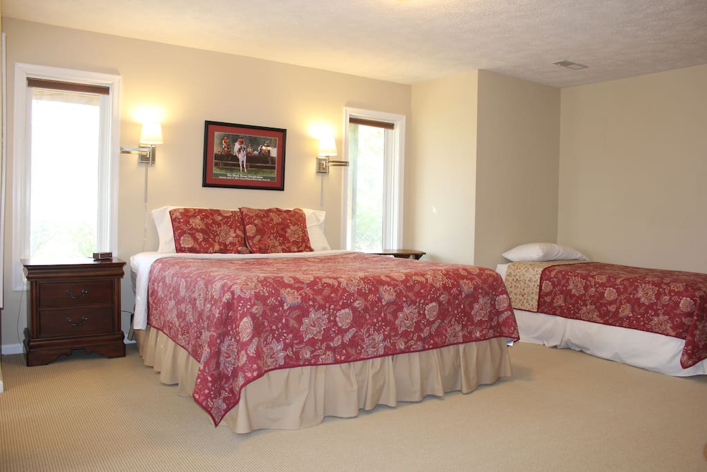 A California king bed and a twin bed.
