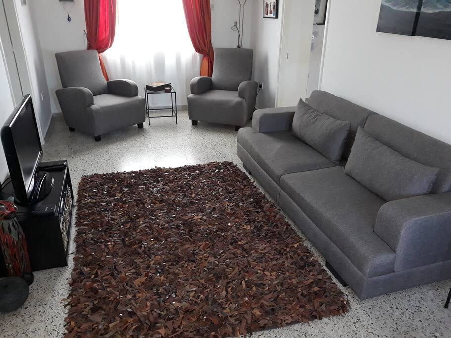 Spacious living room with vaulted ceilings.