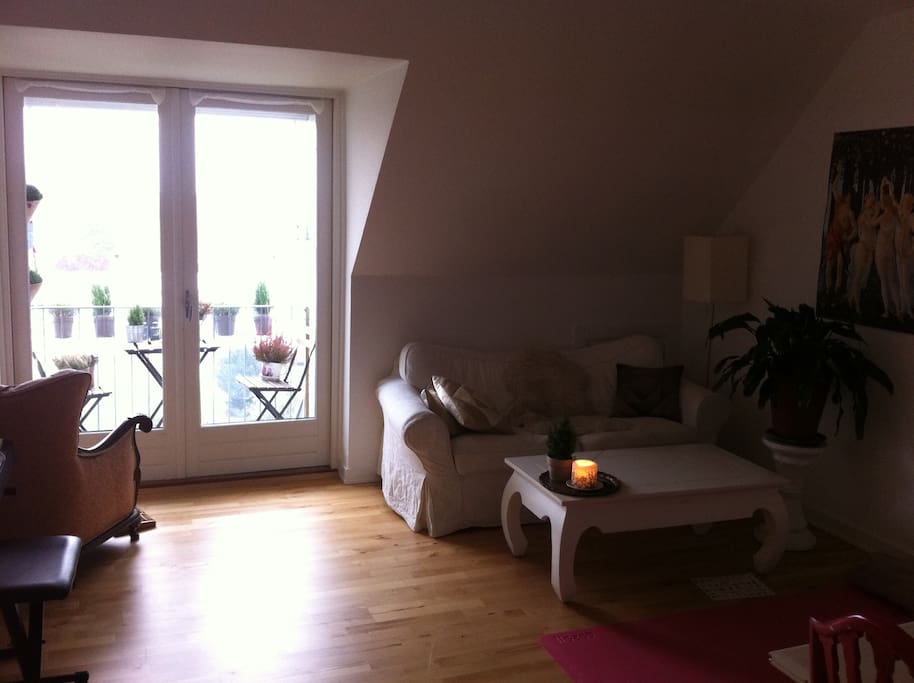 The living room with a small balcony