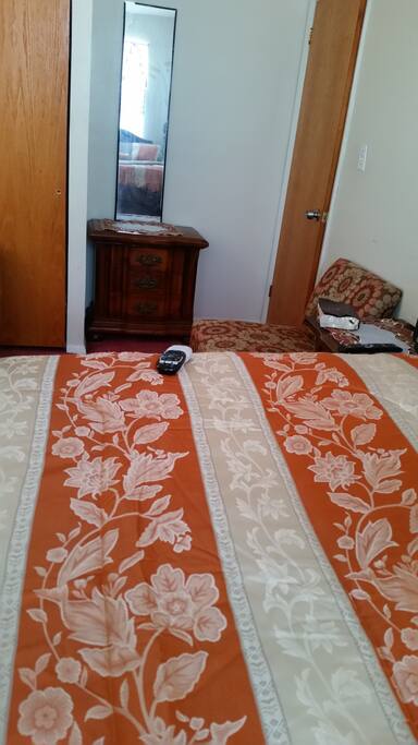 Long view if room laying on bed