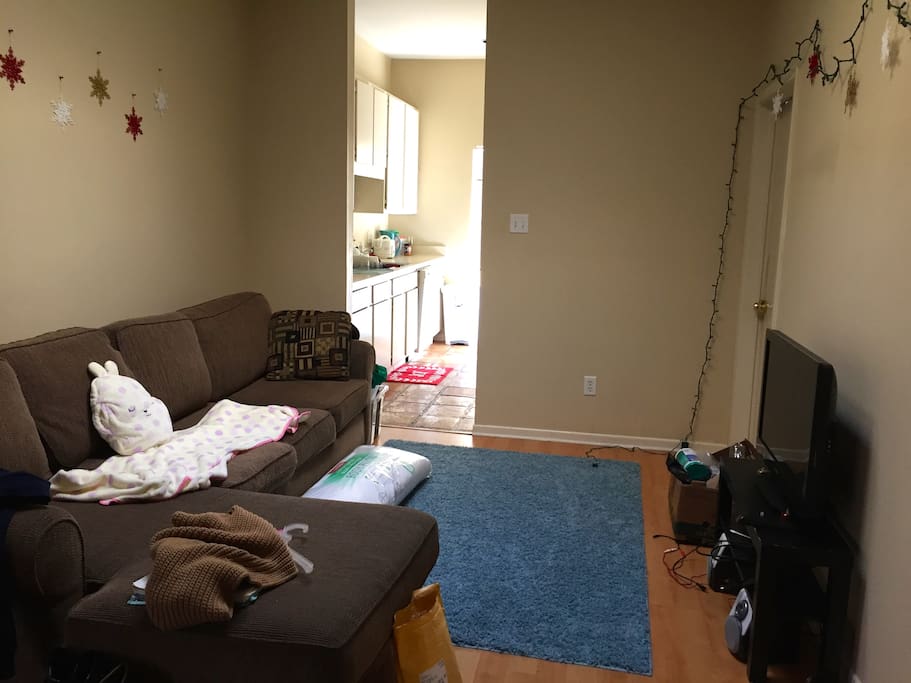 living room with sunroof and large comfortable couch