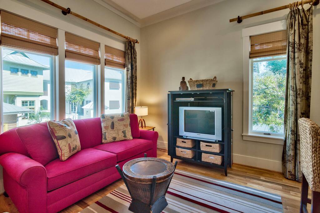 There's a TV in the main living area, and that comfy couch you see is a sleeper sofa.