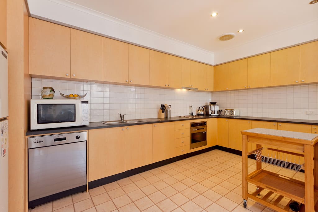 HUGE kitchen with lots of bench space and storage.