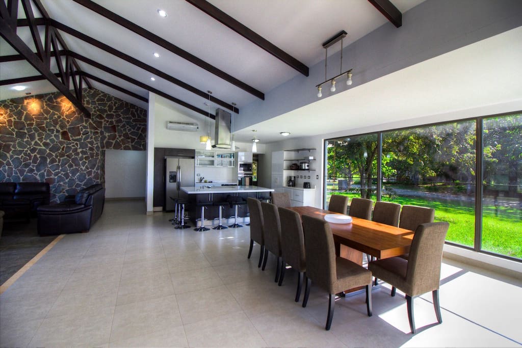 Spacious living area with kitchen and dining table