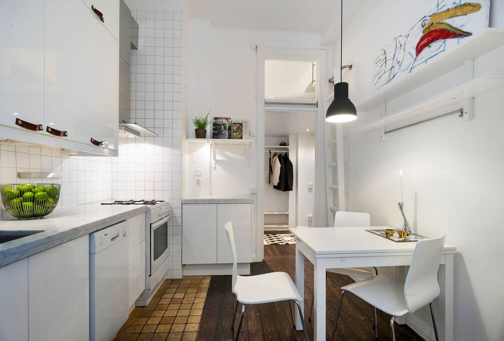 Kitchen - towards the entry (new larger wooden table with 4 chairs)