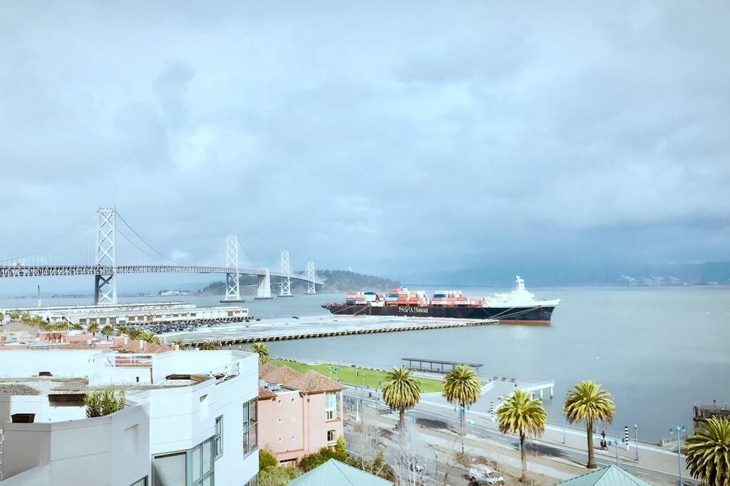 Spacious living room with your breath-taking bay bridge 180 panoramic view.