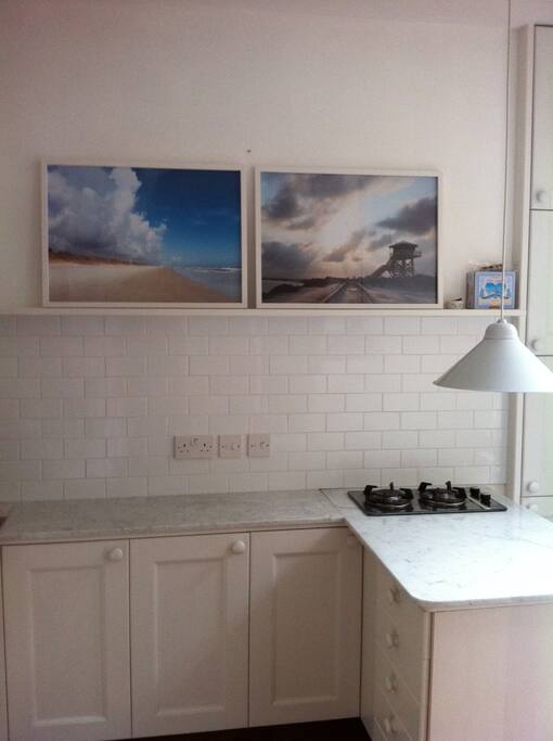 Kitchen with under counter fridge/freezer; washer/dryer; and coffee maker