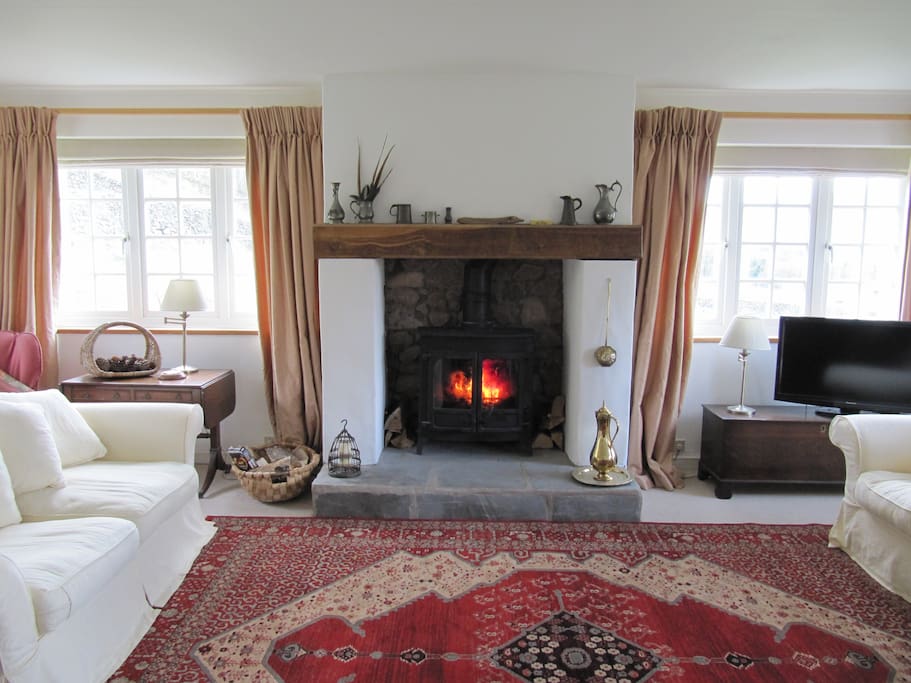living room with views all round to the fells and woodburner