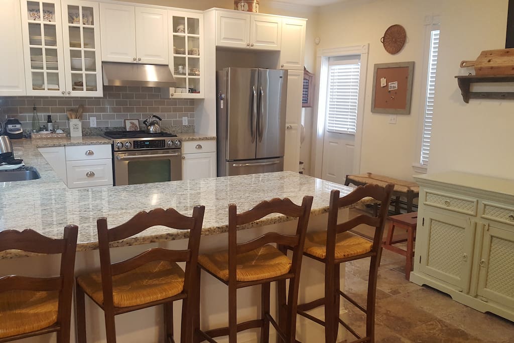 Beautiful kitchen with stools for dining