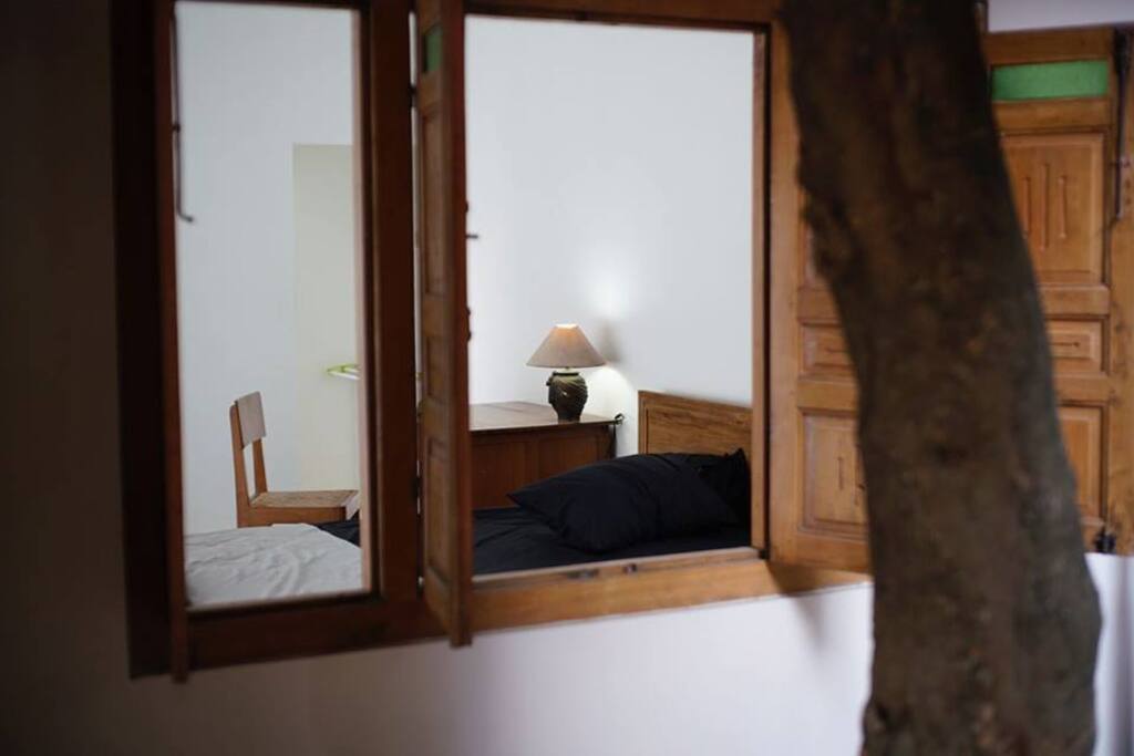 Inside Homestay | Approx 7x7 Mtr Sized Room | standard Facility 1x Kingsize Bed w/ attached bathroom HOT water | AC | we are ready with 1 extra queen size bed | 24hrs Free working space and 24hrs Free High speed WIFI | If needed we have additional 2 wooden Hut each Wooden Hut Furnished w/ 2 x single bed + Fan *check separate listing on this | You will stay at A HOMESTAY inside our Creative Space in the centre of YOGYAKARTA creative City | check visual report of our KELAS PAGI YOGYAKARTA creative space activity at Facebook Profile Album set Open publicly : https://goo.gl/d9JYmQ