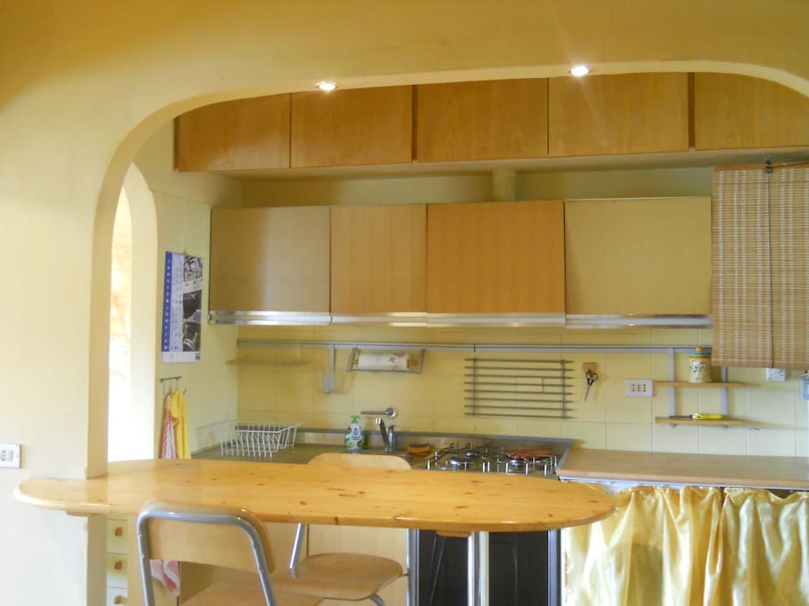 Open space loft kitchen with high chairs and bar!