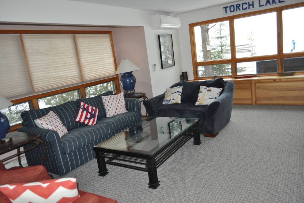 Main sitting area. 2 couches, 1 loveseat, flat screen cable tv, fireplace.
