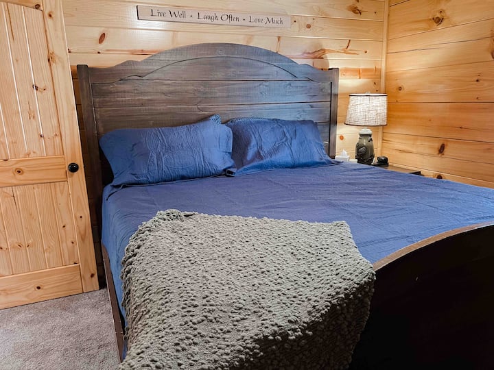 Bedroom 2: king-size bed with ensuite full bath on the main floor.  Room includes a smart TV. 