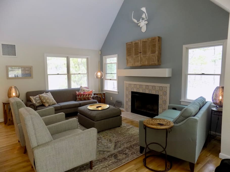 Spacious living room with smart TV and plenty of comfy seating