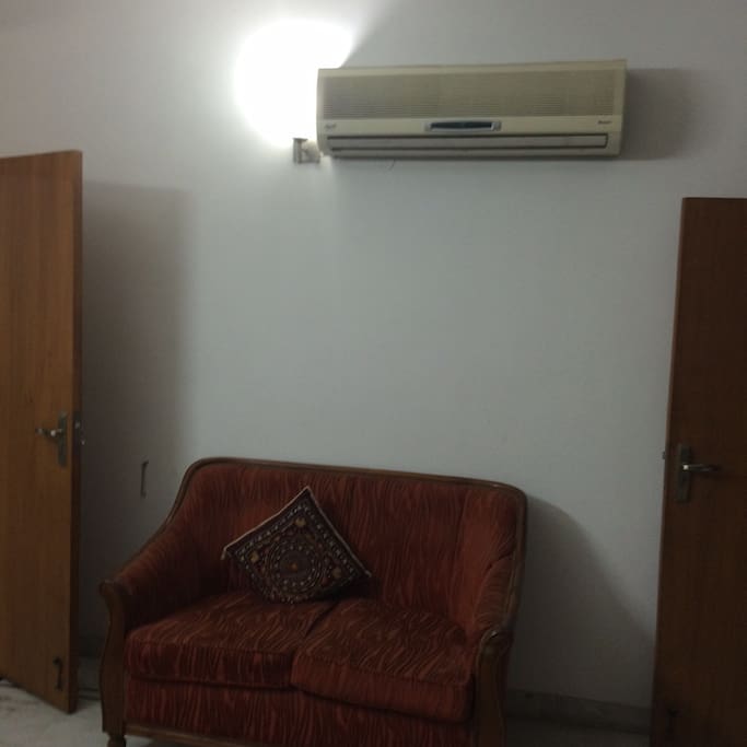 Split AC and sofa.