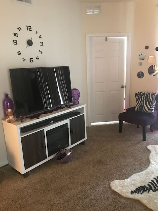 Living room with 55 inch television. Cable and Amazon fire stick available.