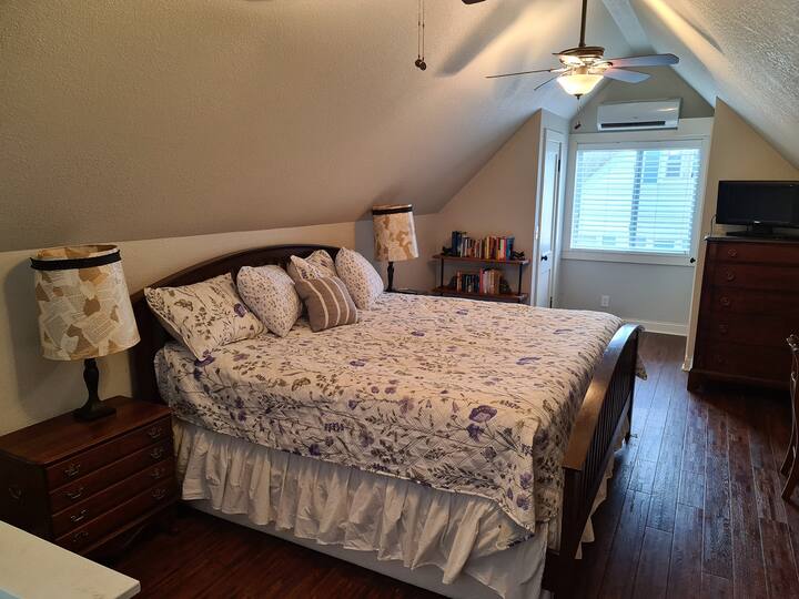 upstairs bedroom with two closets, reading nook, and dresser/nightstand space