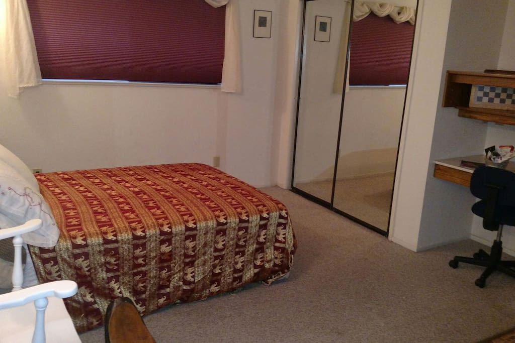 Double bed, full closet and computer workspace.