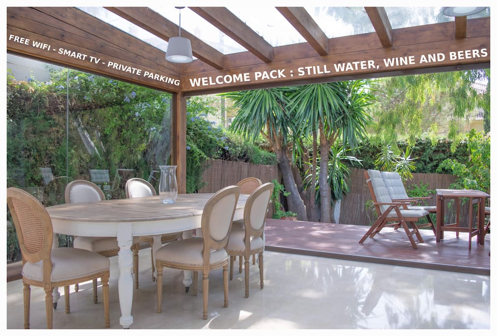 The pergola is a beautiful place to relax with your morning coffee or evening meal