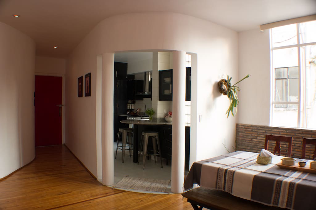 House has beautiful original wood floors and an open kitchen with bar and stools for breakfast or cooking conversations.