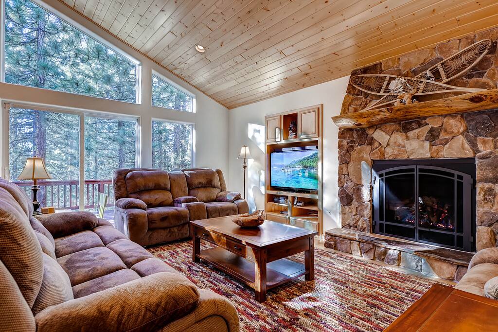 You will feel immediately welcome in this grand, open living space with a fireplace, TV with AV system, and plenty of seating