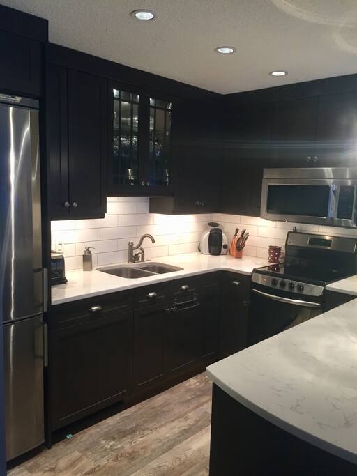 Newly renovated kitchen. Custom cabinets, quartz countertops, stainless appliances, eat up island, Miele silent dishwasher and fully equipped for every type of cook.