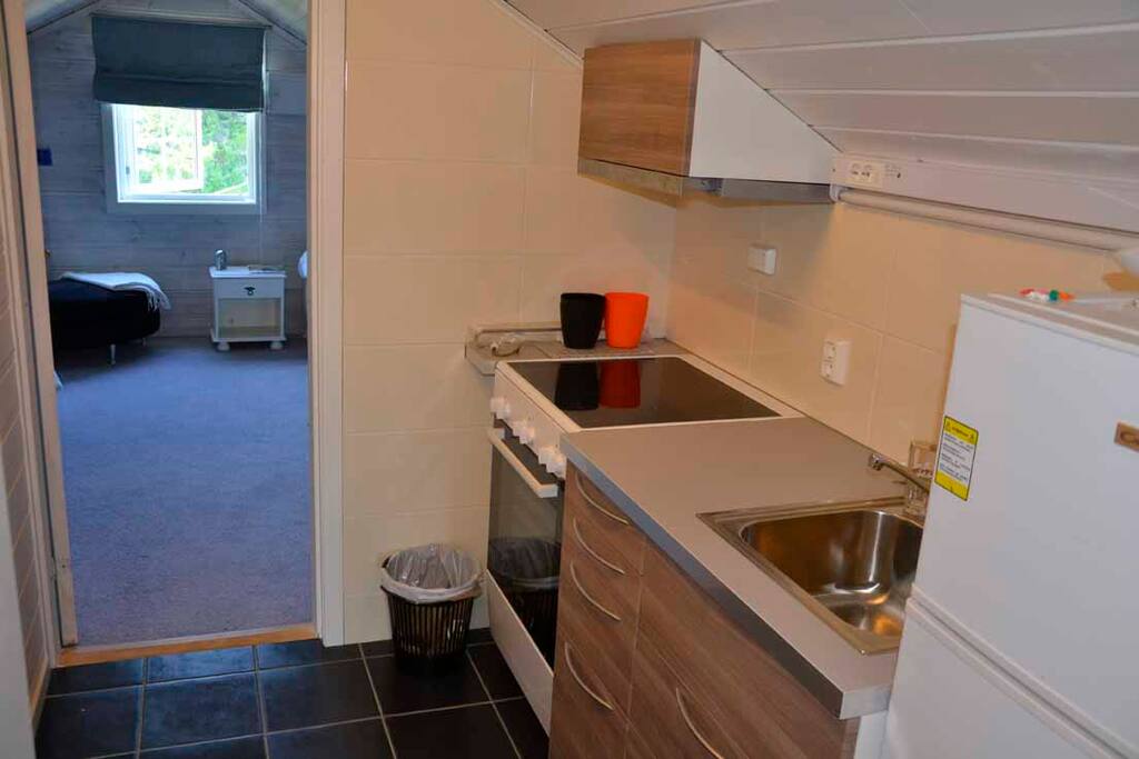 Small Kitchen besides blue and red room