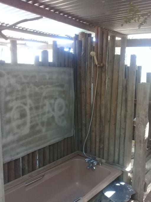 Bush shower next to deck, belongs to this camp site.