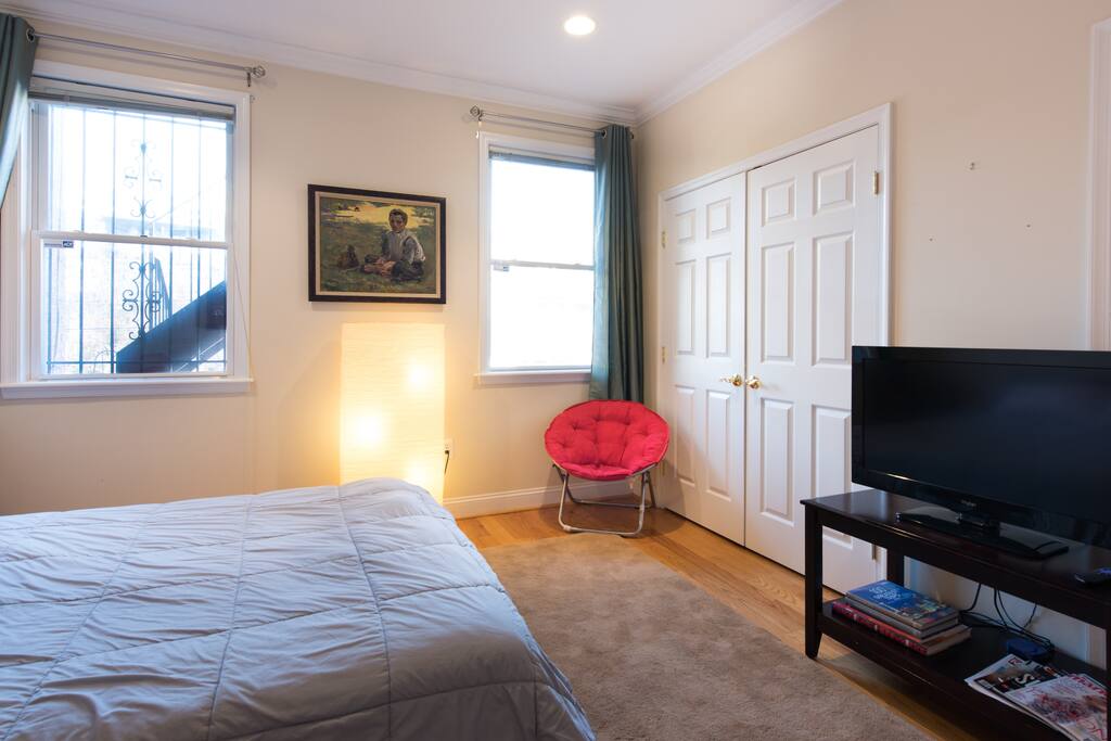 Your private bedroom: view of TV and comfy chair