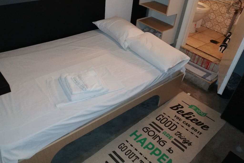 Inside of the studio . New bed
