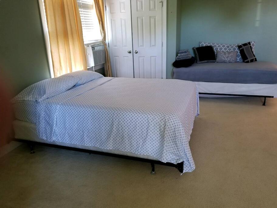 Queen size bed and Twin bed used as couch
