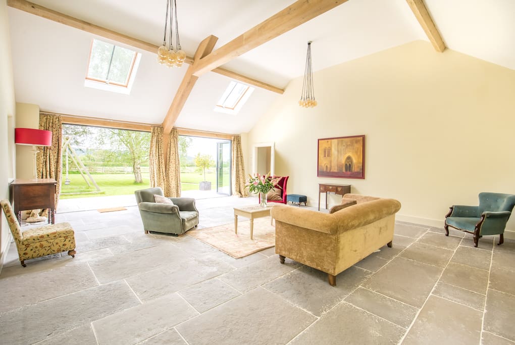 Very large sitting room with doors onto garden