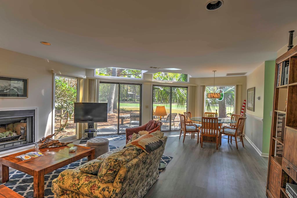 Numerous windows allow the sunlight to illuminate each room while providing splendid views of the surrounding greenery.