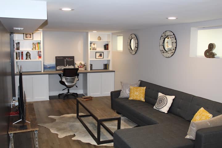 Living room is complete with a huge office desk, perfect for catching up on any work that brings you here. Sleeper sectional sofa can comfortably sleep 2 people. 