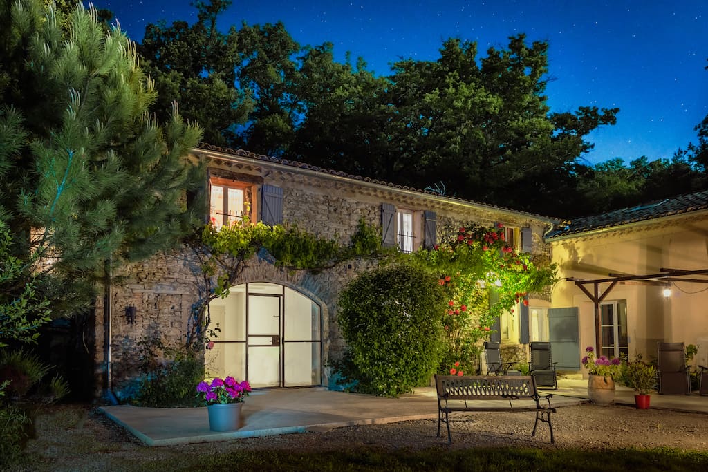 Night view of Les Beaux Chenes gites, surrounded by countryside and starry skies