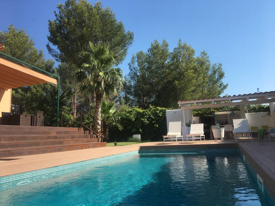 View of the garden with the swimming pool surounded by nature. Non-professional picture.