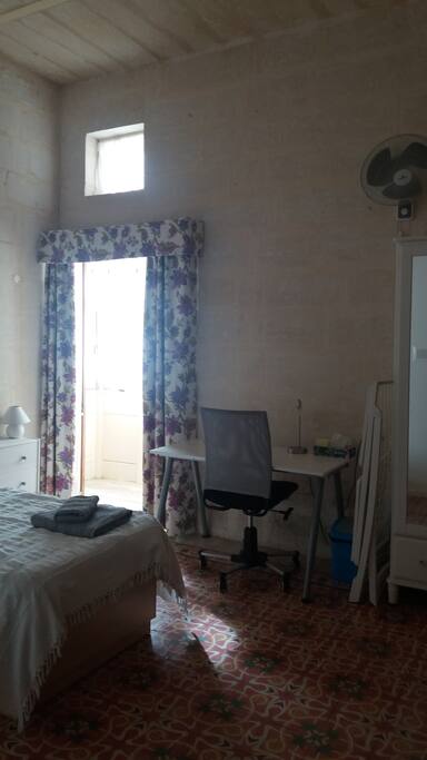 The room is equipped with writing desk, office chair, clothes dryer, wardrobe and a book shelf.