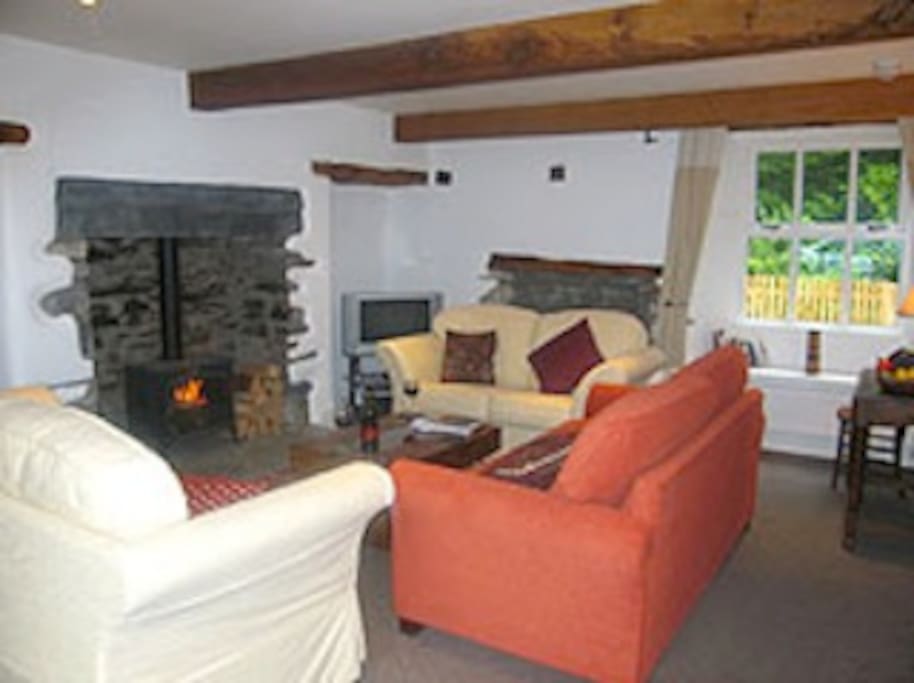 Spacious beamed sitting room