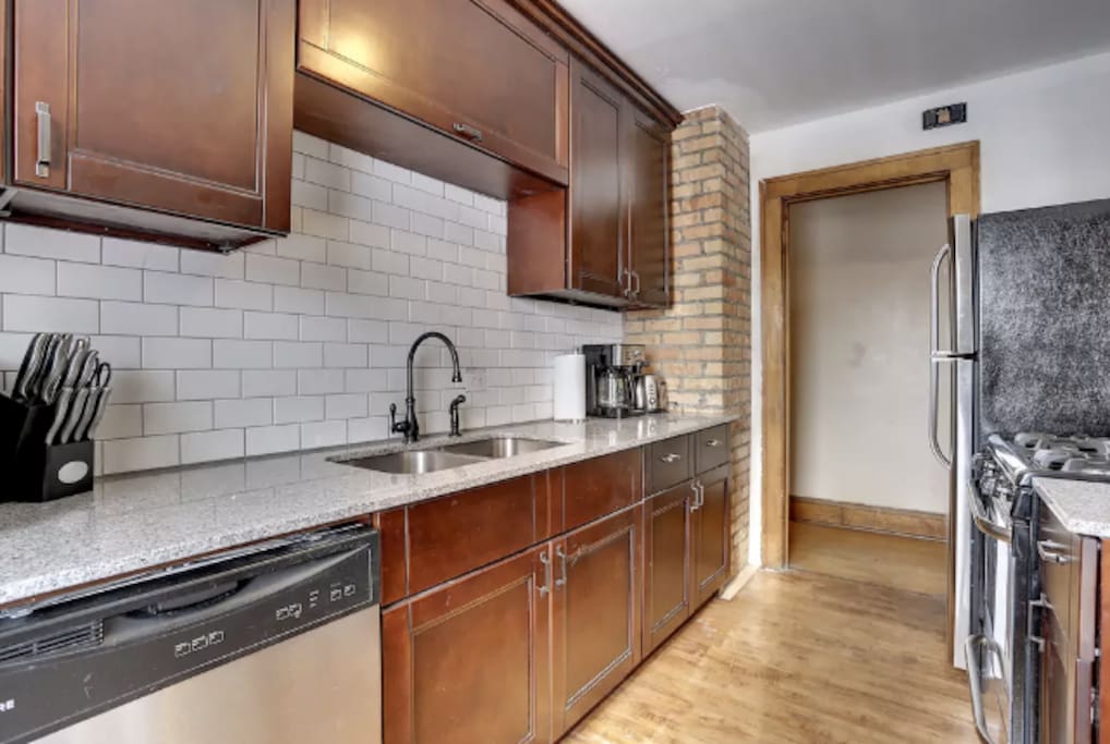 Kitchen remodeled in 2014. SS appliances. Original brick accent with dishwasher in the kitchen