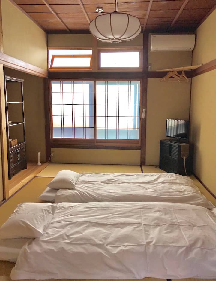 1 of 2 adjoining bedrooms (BR-2) on the 2nd floor  separated by traditional Japanese paper shoji-screen doors.  

There is a 1/2 bath in the hallway outside the two bedrooms.

Your second-floor space.It's connected to the neighbor's room.