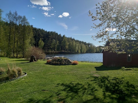 House in our small village with lake, dock and beach