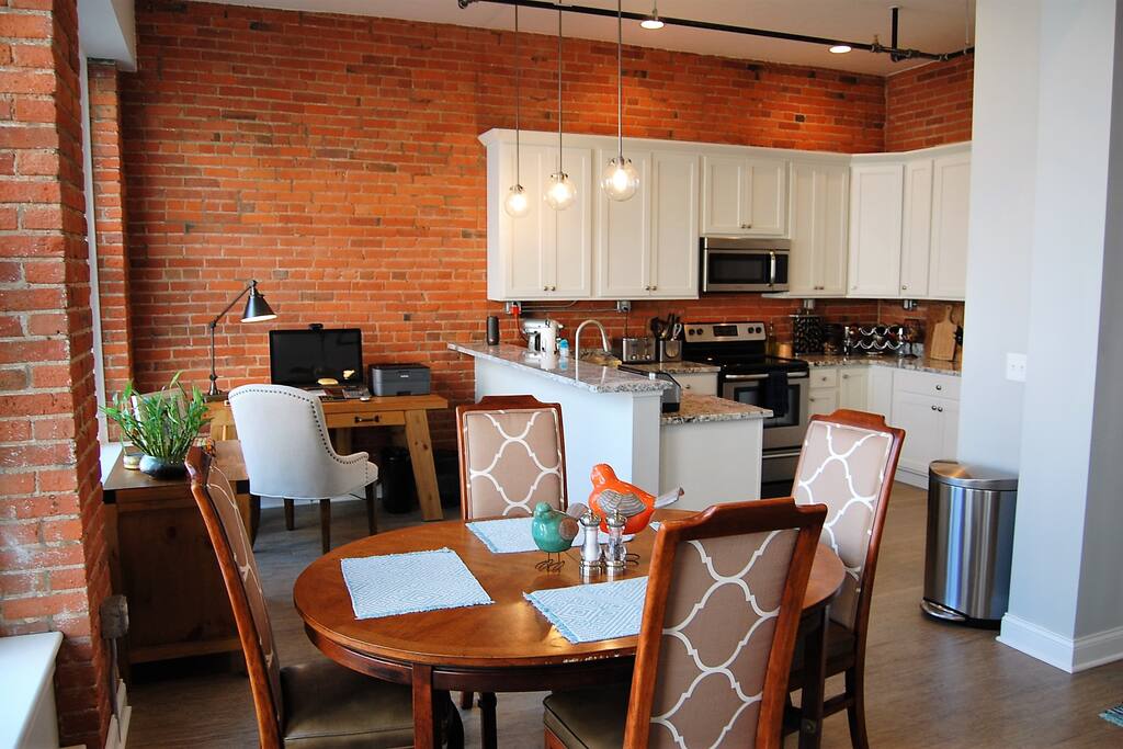 Living space with gourmet kitchen & stainless steel appliances and granite countertops