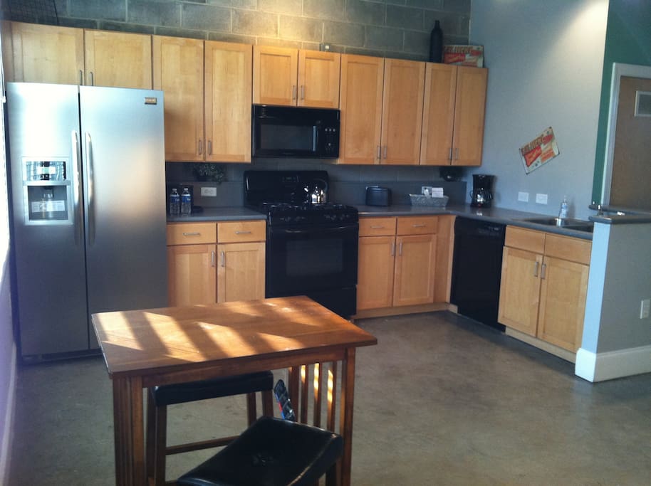 This open kitchen is great for cooking AND it comes fully stocked including spices and condiments. Gas stove, new appliances including microwave. Just bring some food, we've got the rest.