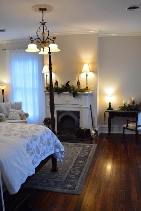 "White Room" showing fireplace, desk and sitting area.