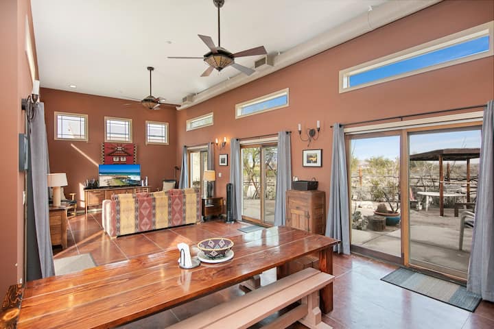 Living room. Large dining table, fireplace, tv and Xbox fireplace