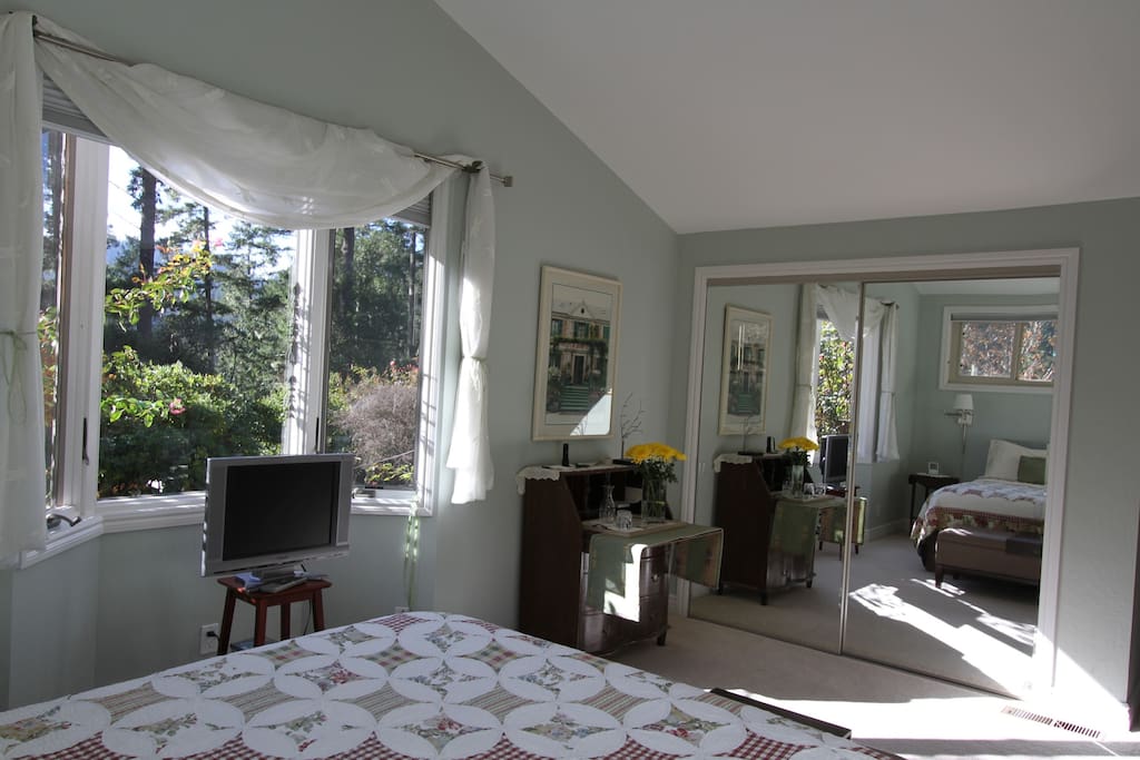 Master Bedroom with garden views, queen size bed and newly remodeled bathroom.