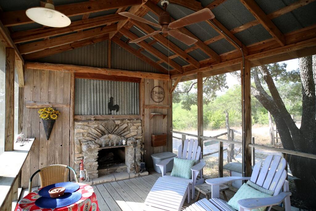 screened porch with fireplace