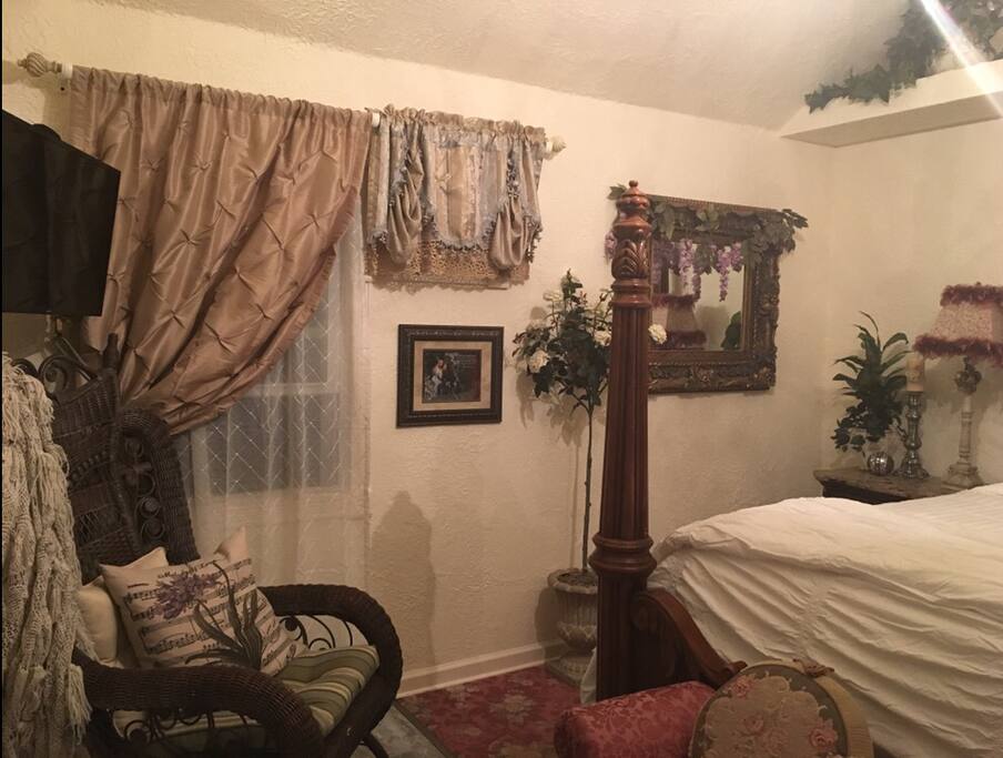 It is a queen size bed with soft down pillows. The room is air conditioned.