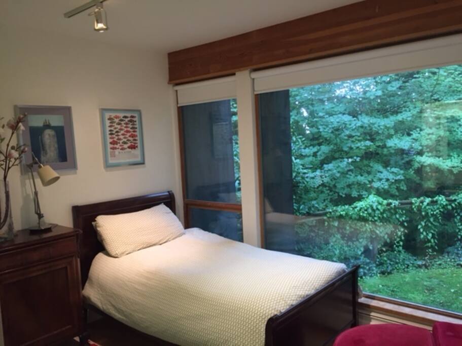 Single bed with down covered duvet